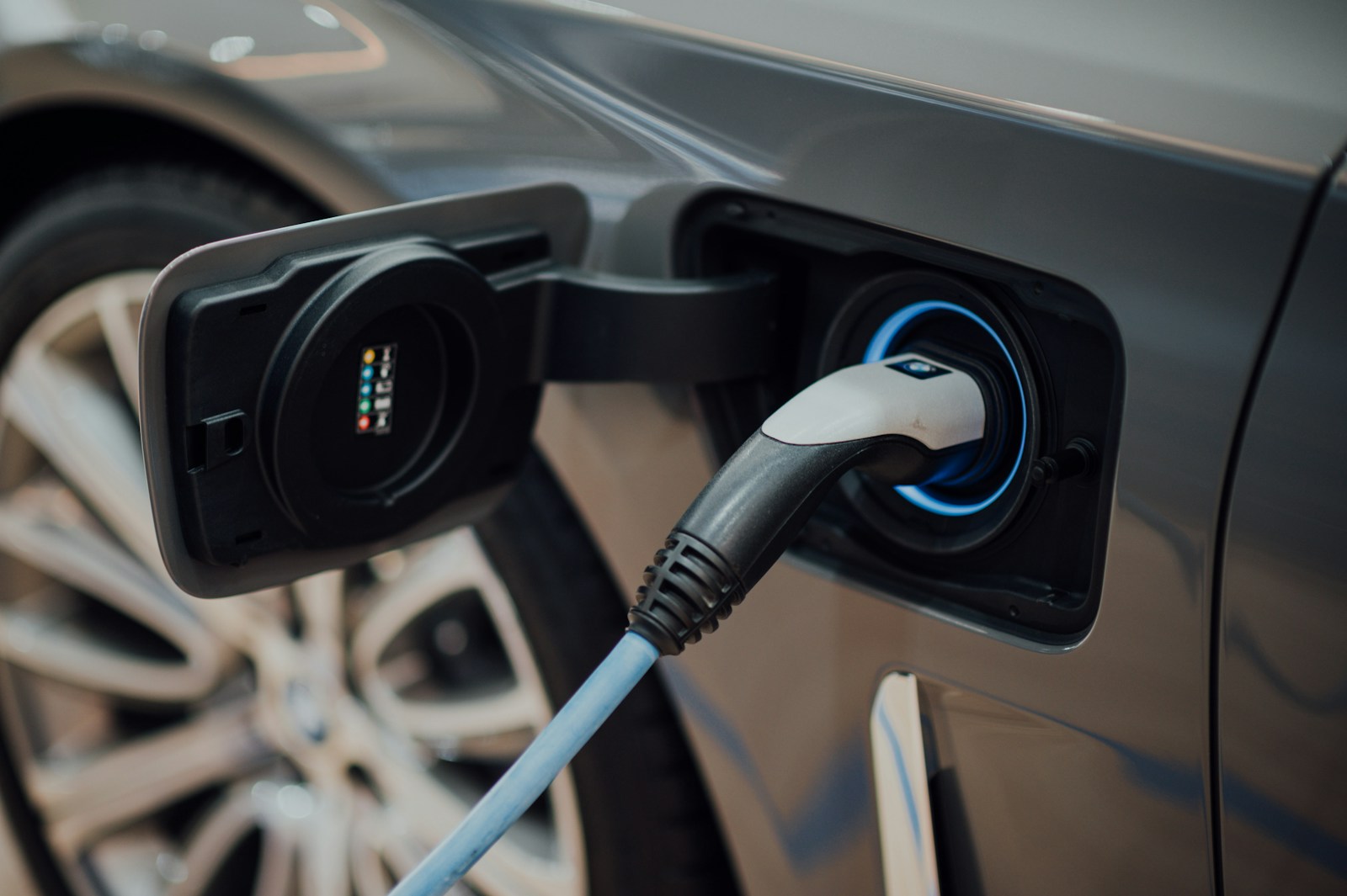 A charging connector plugged into an electric vehicle