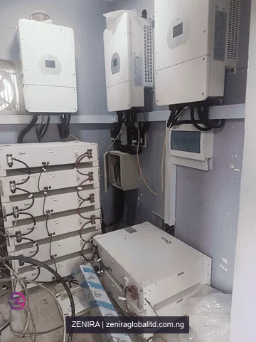 Inverter and battery equipment during installation. Temporary wiring and unfinished work remain visible.